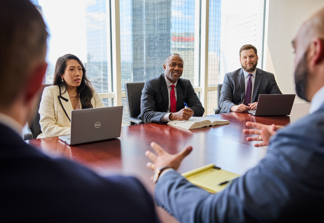Touchstone Bernays legal team meeting in the office conference room to discuss case details