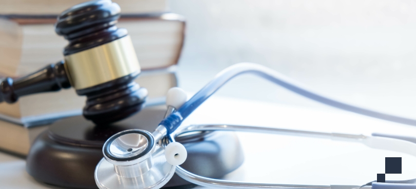Healthcare Liability, claims paperwork on table with legal books in background